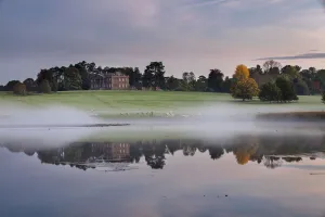 Berrington Hall reflected in lake at dawn, Herefordshire, England, UK, October 2015 Berrington Hall reflected in lake at dawn, Herefordshire, England, UK, October 2015