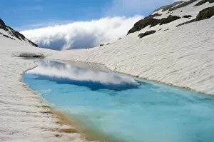 Images Dated 14th May 2011: Blue ice melt pool in snow near the peak of La Munia Circo. The Pyrenees, Aragon