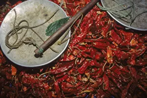 Images Dated 10th April 2003: Chillies & weigh scale at Thimphu market, capital city Central Bhutan