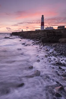 Coastline and Portland Bill Lighthouse at sunset. Isle of Portland, Dorset, England, UK. January 2016 Coastline and Portland Bill Lighthouse at sunset. Isle of Portland, Dorset, England, UK. January 2016