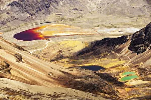 Colourful lakes below the peak of Chacaltaya, lake discoloured by mine effluent Colourful lakes below the peak of Chacaltaya, lake discoloured by mine effluent