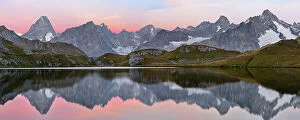 Images Dated 18th September 2012: Colourful pink sky at dawn reflected in Fenetre Lake / Lac de Fenetre in Swiss Alps