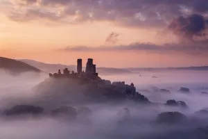 Corfe Castle, early morning llight and mist, Corfe Castle, Dorset, UK. September 2014 Corfe Castle, early morning llight and mist, Corfe Castle, Dorset, UK. September 2014