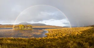 Double rainbow emmerging from rain shower over Loch Awe, Assynt, Scotland, UK Double rainbow emmerging from rain shower over Loch Awe, Assynt, Scotland, UK