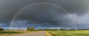 Double rainbow over road through countryside. Nivala, Northern Ostrobothnia, Finland Double rainbow over road through countryside. Nivala, Northern Ostrobothnia, Finland
