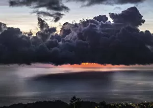 Ominous Gallery: Dramatic sunset with storm clouds over Roseau, Caribbean sea view in Dominica, Lesser Antiles