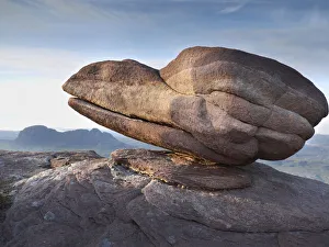 Eroded rock on summit of Cul Mor with Suilven mountain in the background, Assynt mountains Eroded rock on summit of Cul Mor with Suilven mountain in the background, Assynt mountains