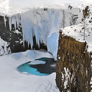 Frozen waterfall in Putoransky State Nature Reserve, Putorana Plateau, Siberia, Russia Frozen waterfall in Putoransky State Nature Reserve, Putorana Plateau, Siberia, Russia