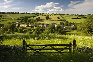 Gate into field looking towards Naunton, The Cotswolds, Gloucestershire Gate into field looking towards Naunton, The Cotswolds, Gloucestershire