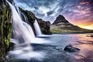 Kirkjufellsfoss waterfall at sunrise, with Kirkjufell mountain in the background Kirkjufellsfoss waterfall at sunrise, with Kirkjufell mountain in the background