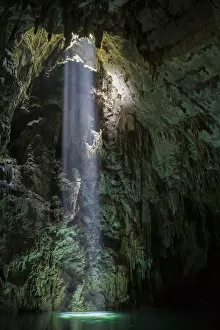 Light shining into Abismo Anhumas or Anhumas Abyss. This is a 80 metre deep lake