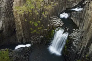 Litlanesfoss waterfall, Hengifoss river, Basalt lava solidified in hexagonal columns Litlanesfoss waterfall, Hengifoss river, Basalt lava solidified in hexagonal columns