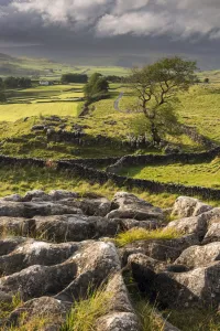 Malham Moor, with stormy skies over Winskill and Ribblesdale with Pen-y-Ghent shrouded in Malham Moor, with stormy skies over Winskill and Ribblesdale with Pen-y-Ghent shrouded in