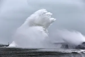 Massive wave crashing into Lesconil during Storm Petra, Finistere, Brittany, France Massive wave crashing into Lesconil during Storm Petra, Finistere, Brittany, France
