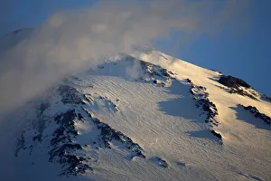 Mount Elbrus the highest mountain in Europe (5,642m) surrounded by clouds seen Mount Elbrus the highest mountain in Europe (5,642m) surrounded by clouds seen