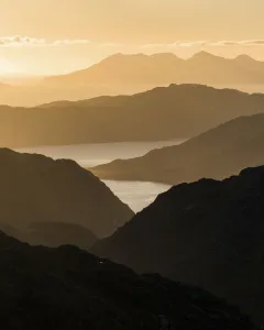 Mountain view towards Loch Nevis overlooking Knoydart peninsula with Skye beyond Mountain view towards Loch Nevis overlooking Knoydart peninsula with Skye beyond