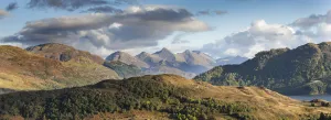 Partially wooded uplands with Five Sisters of Kintail in background, Northwest Highlands Partially wooded uplands with Five Sisters of Kintail in background, Northwest Highlands