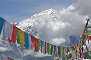 Prayer flags and mountain landscape, Mt Qomolangma National Park, Qinghai Tibet Plateau Prayer flags and mountain landscape, Mt Qomolangma National Park, Qinghai Tibet Plateau