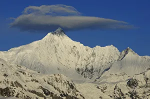 RF- Meili Snow mountain, with lenticular cloud above, Yunnan province, China, April 2011 RF- Meili Snow mountain, with lenticular cloud above, Yunnan province, China, April 2011