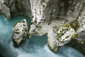 River Soca flowing through Velika korita with erosion in rock visible, Triglav National Park River Soca flowing through Velika korita with erosion in rock visible, Triglav National Park