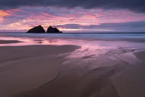 Royalty Prints: Print of a sunset over Holywell Bay at low tide