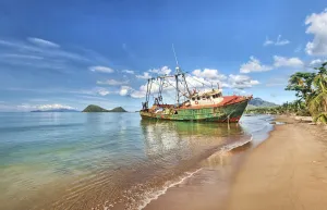 Shipwreck washed ashore by hurricane Maria. Dominica, December 2017. Stitched panorama Shipwreck washed ashore by hurricane Maria. Dominica, December 2017. Stitched panorama