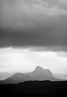 Silhouette of Stac Pollaidh against storm sky, viewed from Tanera More, Coigach and Assynt Silhouette of Stac Pollaidh against storm sky, viewed from Tanera More, Coigach and Assynt
