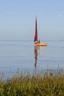 Small traditional sailing boat on the Thames Estuary, Two Tree Island, Essex, England Small traditional sailing boat on the Thames Estuary, Two Tree Island, Essex, England