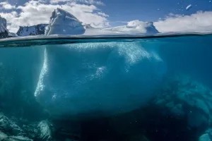 Split level view of an iceberg, Kinnes Cove, Joinville Island, Antarctica Peninsula, Southern Ocean Split level view of an iceberg, Kinnes Cove, Joinville Island, Antarctica Peninsula, Southern Ocean