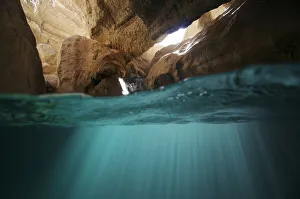 Split level view of water in cave in Wadi Al Shab, Al Sharqiyah South Governorate Split level view of water in cave in Wadi Al Shab, Al Sharqiyah South Governorate