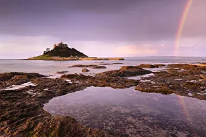 St Michael's Mount at sunrise with a rainbow over Penzance, Marazion, Wesat Cornwall St Michael's Mount at sunrise with a rainbow over Penzance, Marazion, Wesat Cornwall
