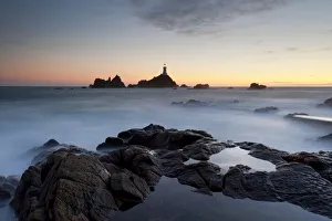Sunset views of La Corbiere lighthouse located at the extreme south-western point of Sunset views of La Corbiere lighthouse located at the extreme south-western point of
