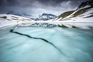 Thawing alpine lake, Vanoise National Park, Rhne-Alpes, France, June Thawing alpine lake, Vanoise National Park, Rhne-Alpes, France, June