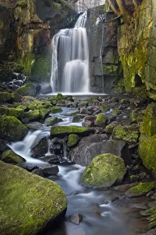Waterfall tumbling over moss-covered boulders at Lumsdale, Derbyshire, UK, January 2012 Waterfall tumbling over moss-covered boulders at Lumsdale, Derbyshire, UK, January 2012