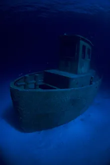 Wreck of tugboat Blue Plunder at night off Nassau, Bahamas Wreck of tugboat Blue Plunder at night off Nassau, Bahamas