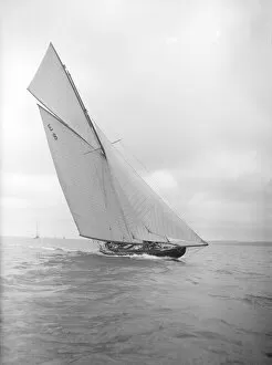 The 12 Metre sailing yacht Rollo racing upwind, 1911. Creator: Kirk & Sons of Cowes