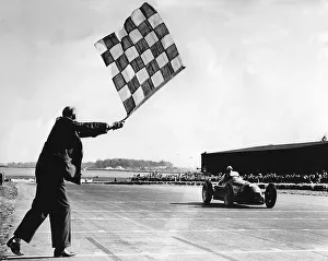 Alfa Romeo, Giuseppe Farina takes chequered flag, British Grand Prix at Silverstone 1950 Alfa Romeo, Giuseppe Farina takes chequered flag, British Grand Prix at Silverstone 1950