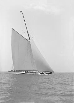 Kirk Sons Of Cowes Collection: Americas Cup challenger Shamrock IV sailing without topsail, 1914. Creator