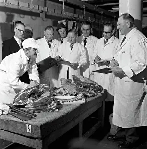 Apprentice butcher showing his work to competition judges, Barnsley, South Yorkshire, 1963 Apprentice butcher showing his work to competition judges, Barnsley, South Yorkshire, 1963