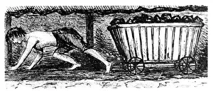 Boy putter drawing a truck containing coal along a 24 inch high seam, Halifax, Yorkshire Boy putter drawing a truck containing coal along a 24 inch high seam, Halifax, Yorkshire