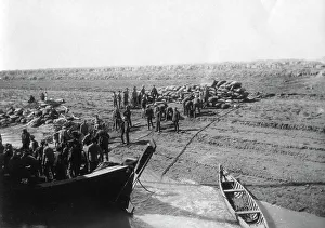 British troops unloading dates on the shore of the Tigris river, 1918. Artist: Unknown British troops unloading dates on the shore of the Tigris river, 1918. Artist: Unknown