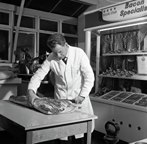 Butcher from Danish Bacon giving a demonstration, Kilnhurst, South Yorkshire, 1961 Butcher from Danish Bacon giving a demonstration, Kilnhurst, South Yorkshire, 1961