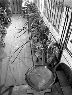 Continuous sharpening of longsaw blades, Slack Sellars & Co, Sheffield, South Yorkshire, 1963 Continuous sharpening of longsaw blades, Slack Sellars & Co, Sheffield, South Yorkshire, 1963