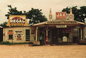 Liquor Gallery: A cross roads store, bar, 'juke joint, 'and gas...in the cotton plantation area, Melrose, La. 1940