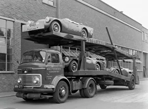 Docks Collection: Daimler Dart SP250s on car transporter for delivery 1960. Creator: Unknown