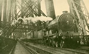An Express Train Crossing the Forth Bridge, c1930. Creator: Leslie J. Thompson