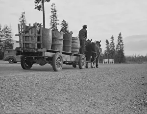 Farmer and his boy hauling water for drinking and domestic purposes... Boundary County, Idaho Farmer and his boy hauling water for drinking and domestic purposes... Boundary County, Idaho