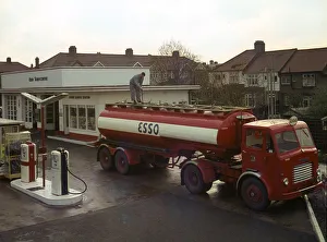 Ilford Esso petrol station with Leyland tanker making delivery 1964. Creator: Unknown Ilford Esso petrol station with Leyland tanker making delivery 1964. Creator: Unknown