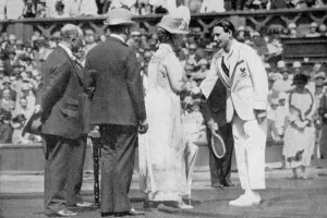 Jean Borotra receives his medal from Queen Mary on centre court, 1926. Artist: London News Agency Jean Borotra receives his medal from Queen Mary on centre court, 1926. Artist: London News Agency