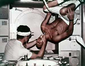 Kerwin examining Conrad on Skylab 2, 1973. Creator: NASA Kerwin examining Conrad on Skylab 2, 1973. Creator: NASA
